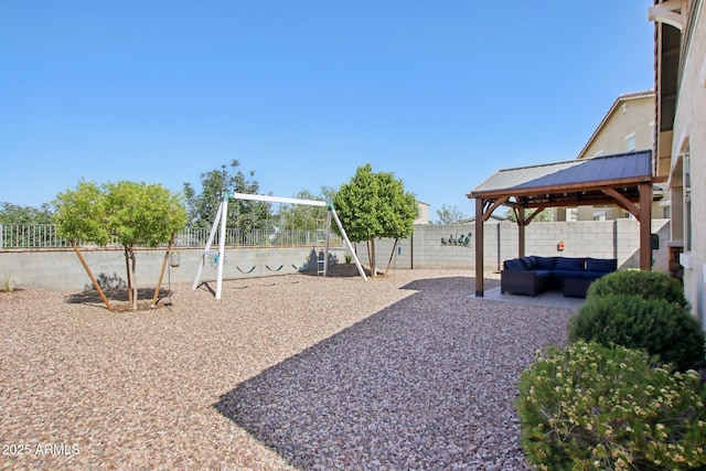5724 N 108th Ave, Phoenix, AZ 85037 - fenced backyard with a gazebo, outdoor lounge area, a playground, and a patio area