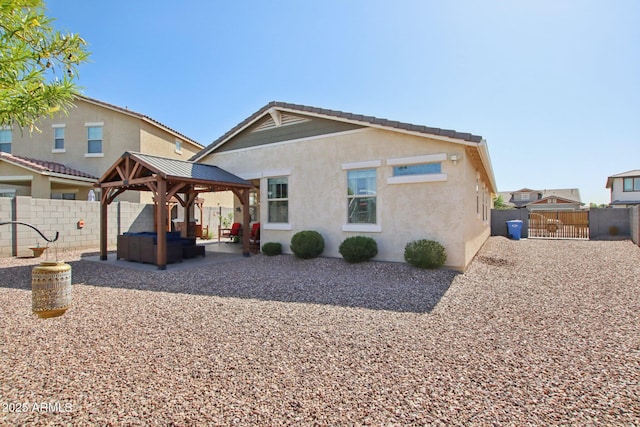 5724 N 108th Ave, Phoenix, AZ 85037 - rear view of property with a gazebo, a patio, a fenced backyard, and outdoor lounge area