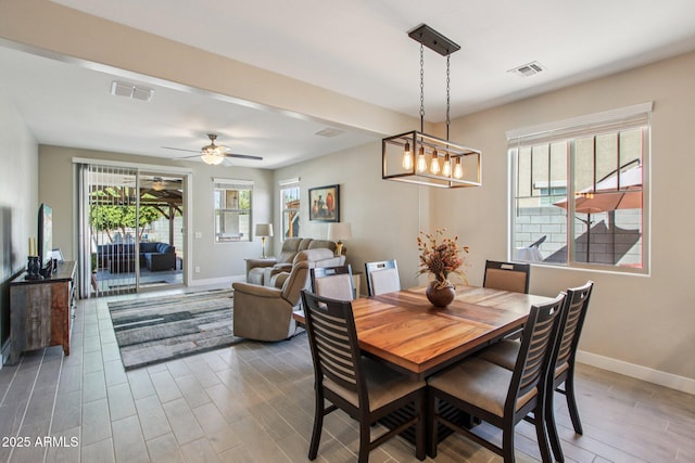 5724 N 108th Ave, Phoenix, AZ 85037 - dining space featuring wood finished floors and a ceiling fan