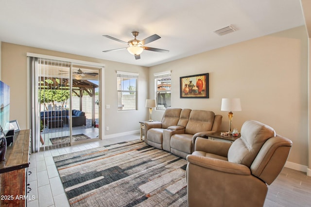 5724 N 108th Ave, Phoenix, AZ 85037 - living area with ceiling fan and baseboards