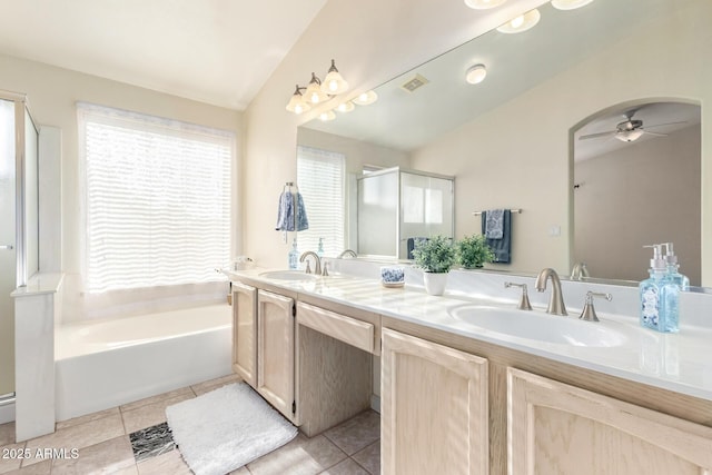 bathroom with visible vents, ceiling fan, a sink, tile patterned flooring, and a bath