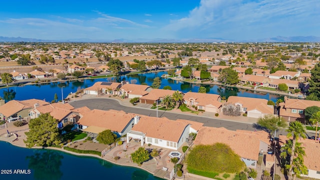 aerial view with a water view and a residential view