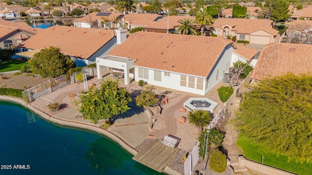 bird's eye view featuring a residential view and a water view