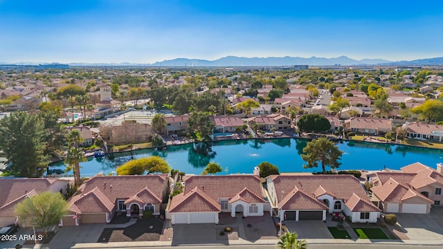 aerial view featuring a residential view and a water and mountain view