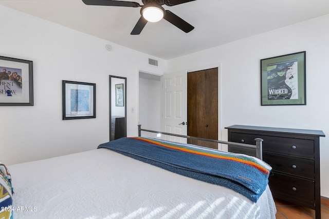 bedroom featuring tile patterned flooring and ceiling fan