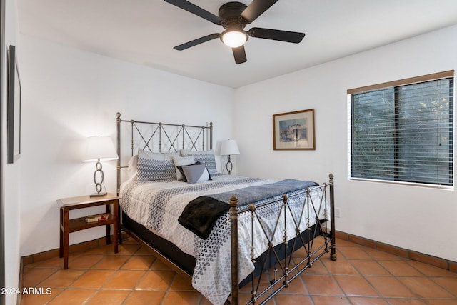 bedroom featuring tile patterned floors and ceiling fan