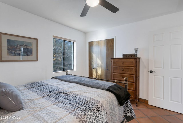 bedroom featuring tile patterned floors and ceiling fan