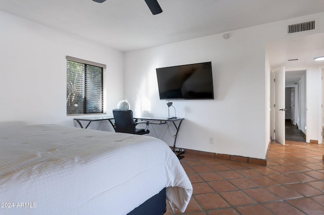 tiled bedroom with ceiling fan