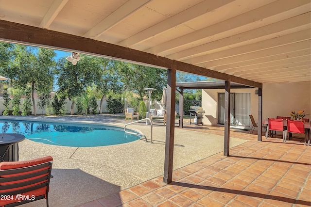 view of swimming pool featuring a patio