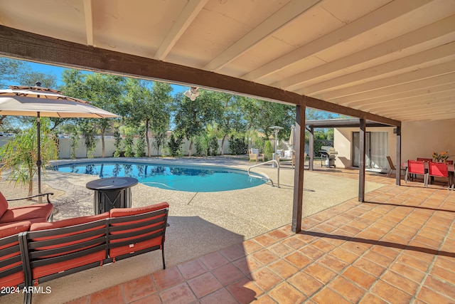 view of pool featuring outdoor lounge area and a patio