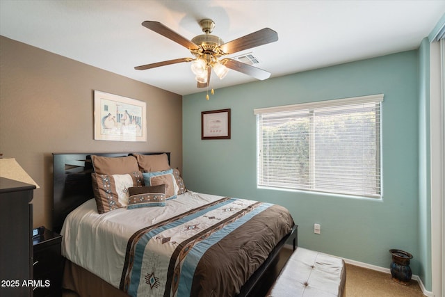 bedroom with ceiling fan and carpet floors