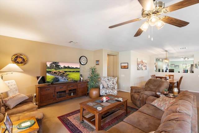 living room with carpet and ceiling fan