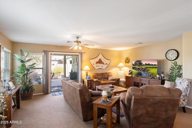 living room featuring light carpet and ceiling fan