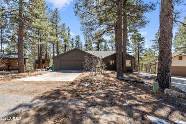 3278 Shonto Trl, Flagstaff, AZ 86005 - chalet / cabin featuring a garage and driveway