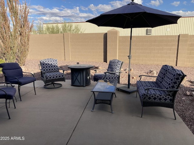 view of patio / terrace featuring an outdoor fire pit