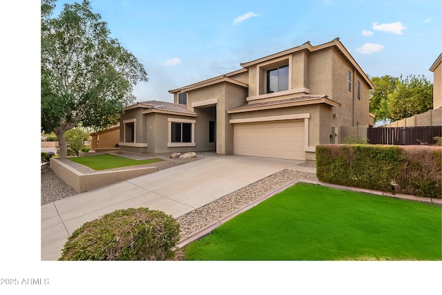 prairie-style house featuring stucco siding, a front lawn, driveway, fence, and an attached garage