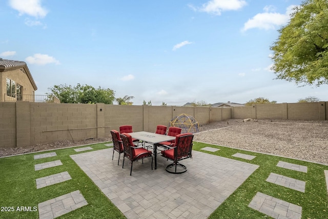 view of patio / terrace featuring outdoor dining area and a fenced backyard