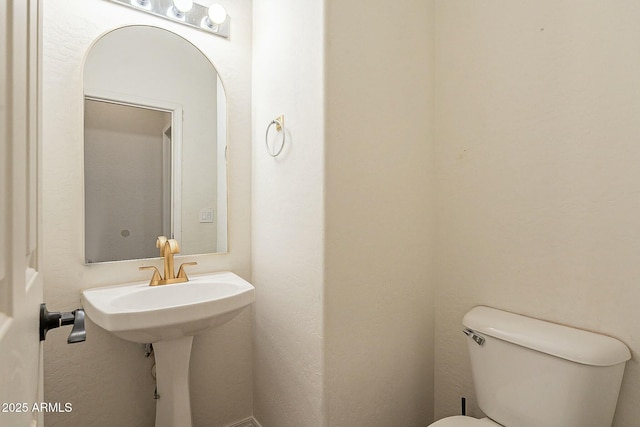 bathroom featuring toilet