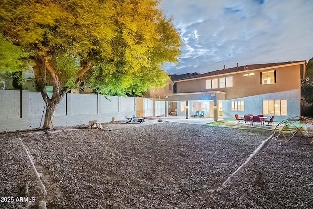 view of yard featuring a patio and a fenced backyard