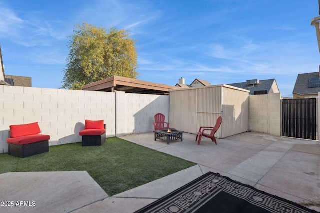 view of yard with a fire pit and a patio