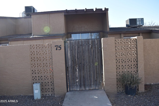 view of gate featuring central AC