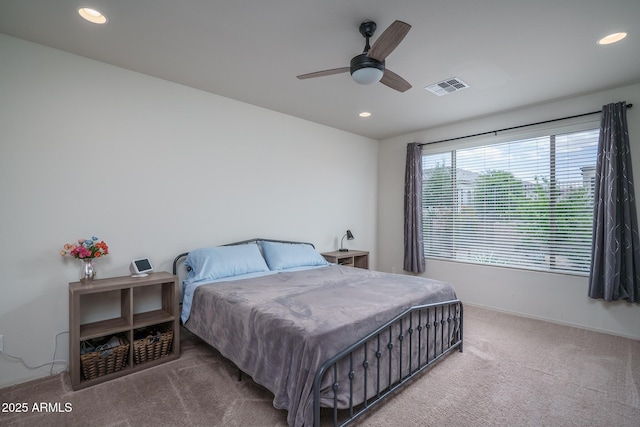 carpeted bedroom featuring recessed lighting, ceiling fan, visible vents, and baseboards