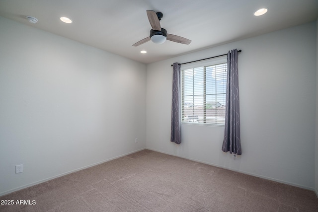 spare room with light colored carpet, recessed lighting, and ceiling fan