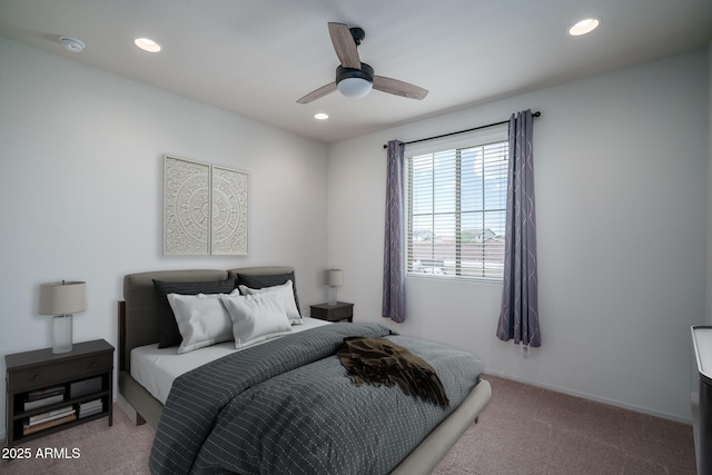 carpeted bedroom with a ceiling fan and recessed lighting