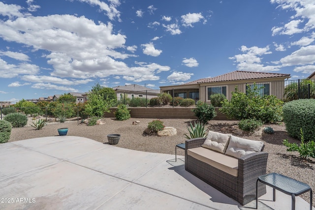 view of patio / terrace featuring fence and an outdoor living space