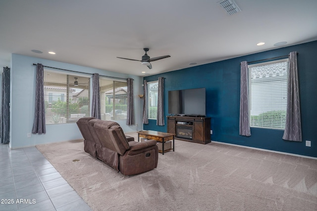 tiled living room featuring plenty of natural light, a ceiling fan, recessed lighting, and visible vents