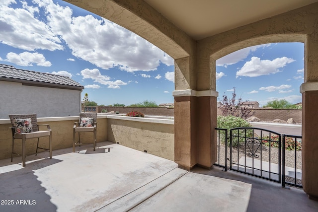 view of patio featuring a balcony