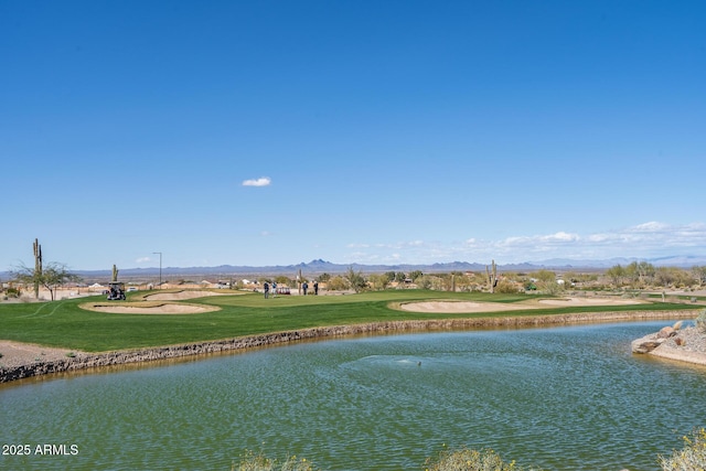 property view of water with a mountain view and golf course view