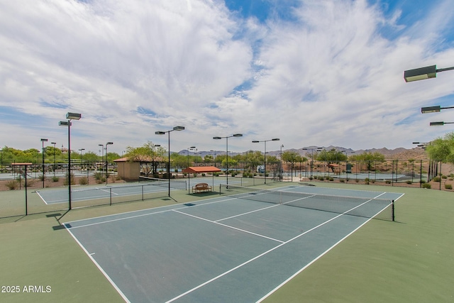 view of sport court with fence