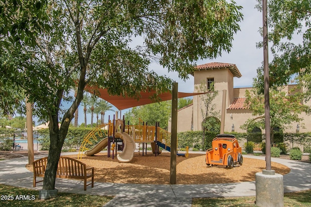 community jungle gym featuring fence