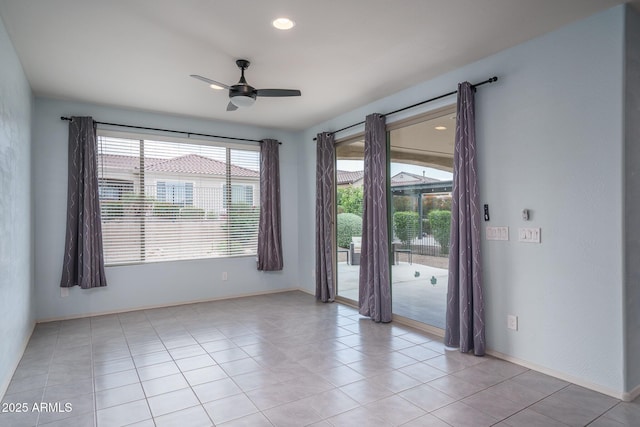 spare room with light tile patterned floors, ceiling fan, recessed lighting, and baseboards
