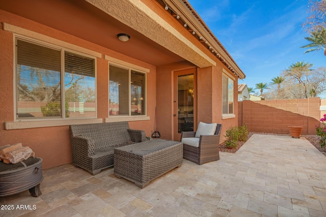 view of patio / terrace featuring fence and an outdoor living space