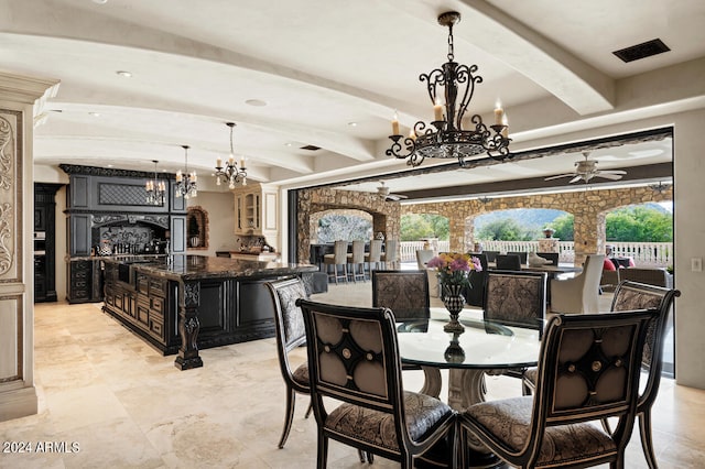 dining space with ceiling fan with notable chandelier and beam ceiling