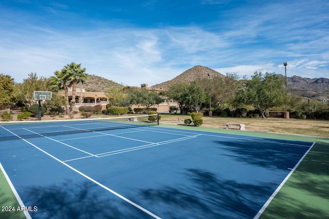 view of sport court with a mountain view