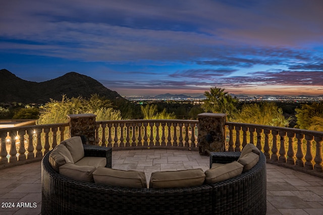 deck at dusk with a mountain view