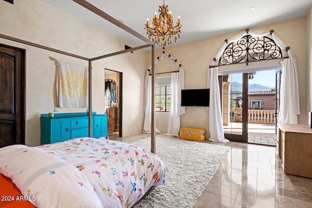 bedroom with an inviting chandelier and access to outside