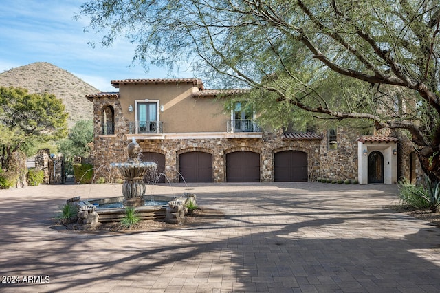 mediterranean / spanish house featuring a garage