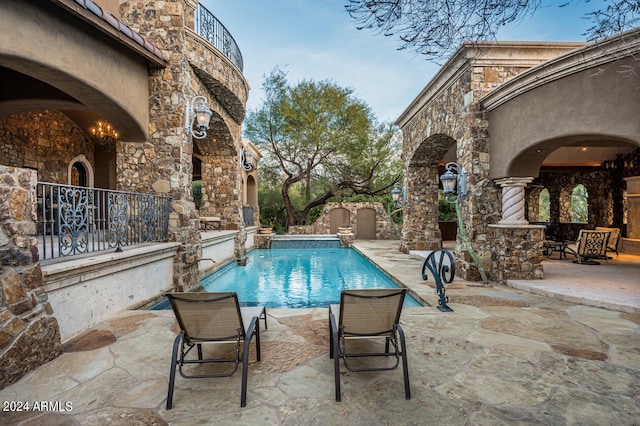 view of pool featuring a patio area