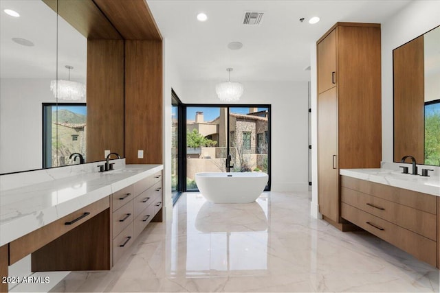 bathroom with a wealth of natural light, oversized vanity, and tile floors