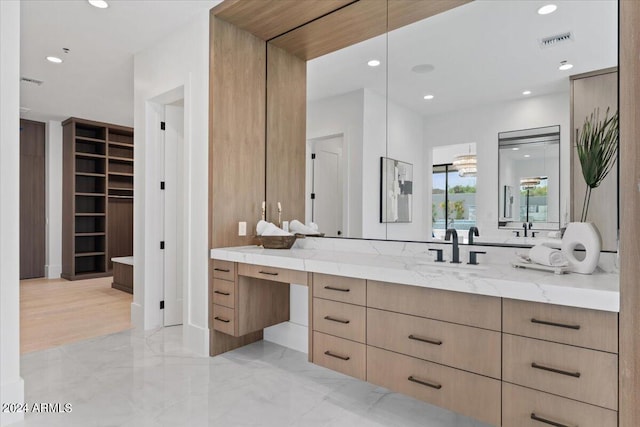 bathroom featuring tile floors and vanity