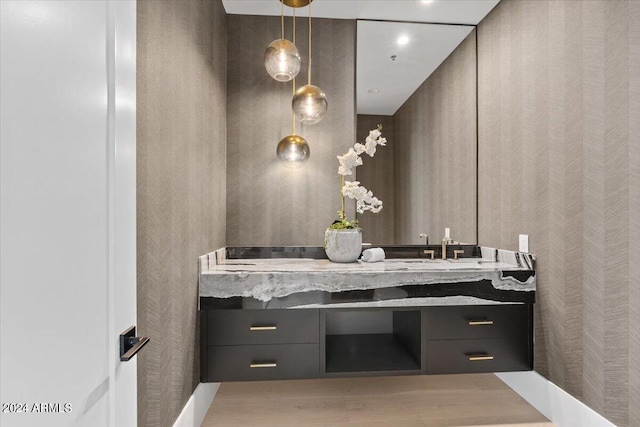 bathroom with wood-type flooring and vanity