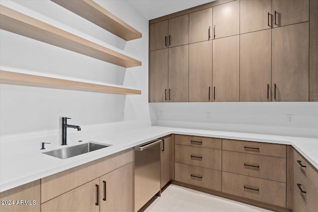 kitchen with sink and light tile flooring