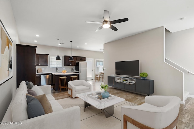 3010 N 37th St Unit 6, Phoenix, AZ 85018 - living area with light wood finished floors, a ceiling fan, recessed lighting, and baseboards
