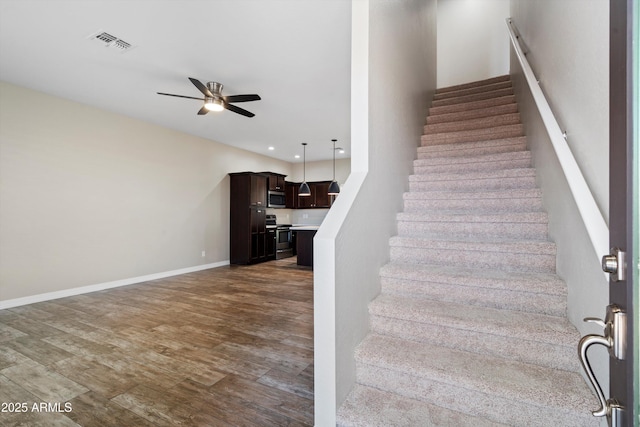 3010 N 37th St Unit 6, Phoenix, AZ 85018 - stairway featuring a ceiling fan, wood finished floors, baseboards, and recessed lighting