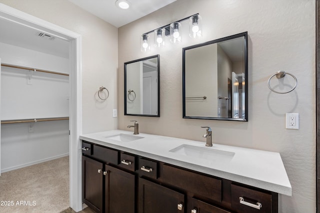 3010 N 37th St Unit 6, Phoenix, AZ 85018 - full bathroom featuring double vanity, a spacious closet, and baseboards