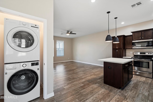 3010 N 37th St Unit 6, Phoenix, AZ 85018 - washroom with stacked washer / dryer, a ceiling fan, baseboards, dark wood-style floors, and recessed lighting